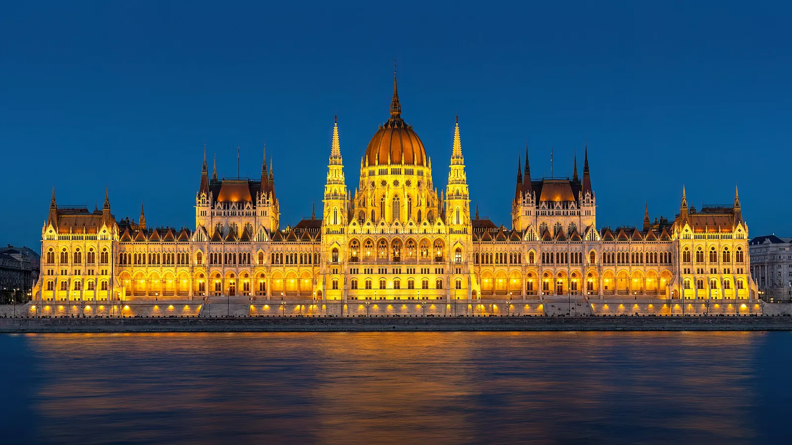 Baroque skyline over a river at dawn on a Central Europe rail itinerary